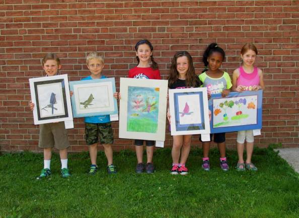 Seven of Mrs. Denise Docherty&#x2019;s art students from Walnut Ridge Primary School in Vernon recently had artwork on display at Valley National Bank. The work had previously been exhibited at the EarthFest event at Heaven Hill Farm. Gavin, Timmy, Brianna, Bella, Karissa, Paige, and Amanda received certificates from the bank and were very proud to have had their work selected for this display. Pictured are some of the students with their artwork.