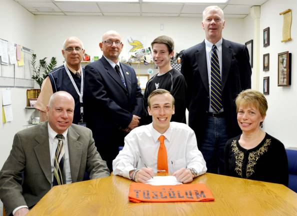 Vernon senior lacrosse athlete Charles Mills signs his National Letter of Intent to play lacrosse at Tusculum College in Greeneville, Tennessee. Seated in the front row from left are Rich Mills, Charles and Lisa Mills. In back from left, are Vernon Athletic Director Bill Edelman, Coach Harry Shortway, Joseph Mills and Principal Tim Dunnigan.