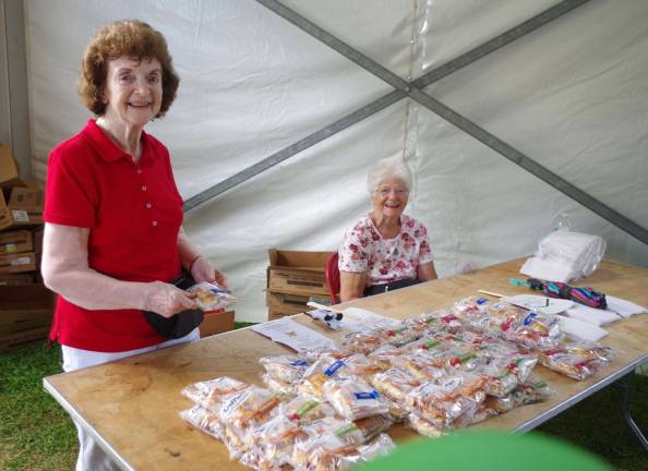 Vernon Township senior volunteers Shirley Baldwin (left) and Terri Van Emburgh offered pastries to the visiting fairgoers.
