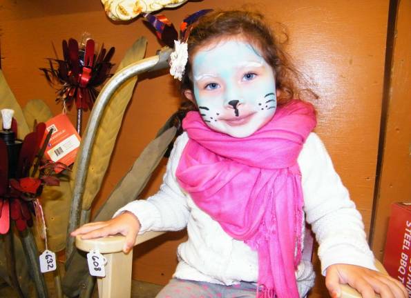 Rain doesn't affect fall festival Sofia Hallak, 3, of Wantage models her blue cat-face at the Sussex Christian School's 37th annual harvest festival on Saturday.