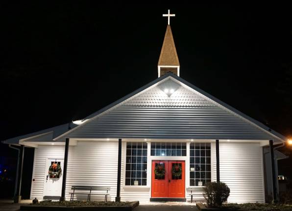 PHOTOS BY VERA OLINSKIHighland Lakes Christ Community Church shines in the darkness.