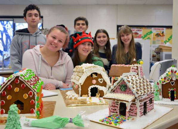 &#x2018;Tis the season for Mrs. Marjorie Cobley&#x2019;s Gourmet Foods class to design and build their gingerbread houses. Here the Vernon Township High School bakers show off their prized seasonal real estate. Back row, from left, are Alex Kniazev and Mark Reilly. Front row, from left, are Samantha DuBois, Alicia Mihalko, Allison Rowen and Sophia Amati.