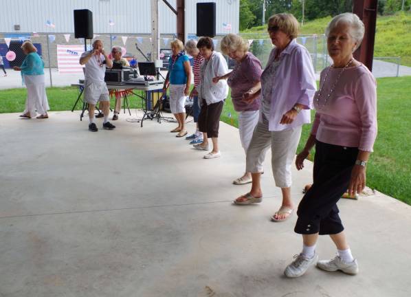 Some of the ladies enjoyed line dancing to music provided by DJ Ray Sikora of Ogdensburg.
