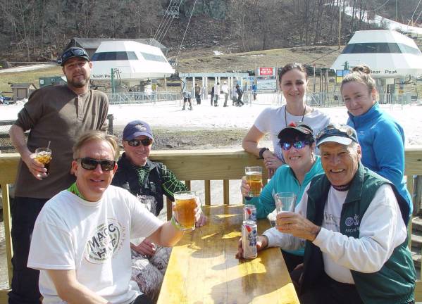 The Mountain Creek Die-Hards toast another fun day of skiing at Mountain Creek South with 2 Resort staffers.