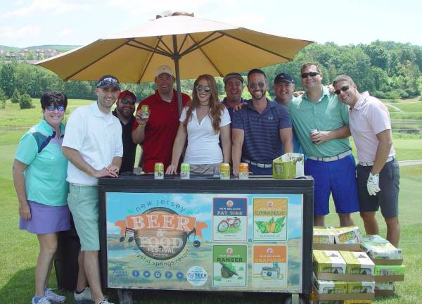 Golfers take a break from their round to enjoy a cold beer from one of the NJ Beer &amp; Food Festival beer sponsors
