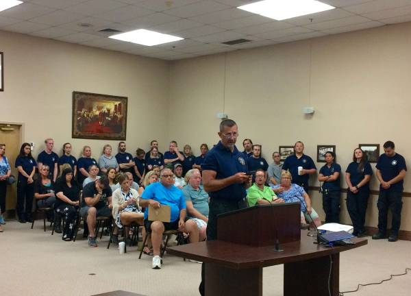 Photo by Diana Goovaerts Thirteen-year Glenwood Pochuck Ambulance Corps. member Scott Berge addresses the Vernon Township Council.