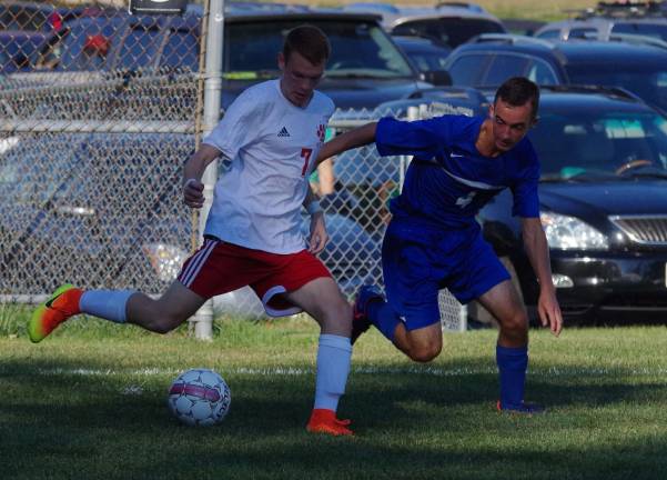 High Point's Korey Roman is challenged by Kittatinny's Tom Hull for possesion of the ball.
