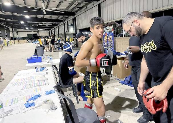 Teen kick boxer challenged by weightier opponents, emerges a champion Daniel Roque at the WKA USA National Championships