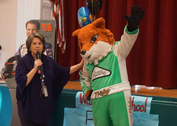 Photos by Vera Olinski Wantage School Nurse Deb Fisher introduces Pocono Raceway's Tricky the Triangle Fox during the Race to the Good Nutrition assembly.