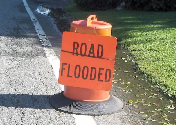 Road flooded signs were typical like this one in the Glenwood section of Vernon (Photo by Janet Redyke)