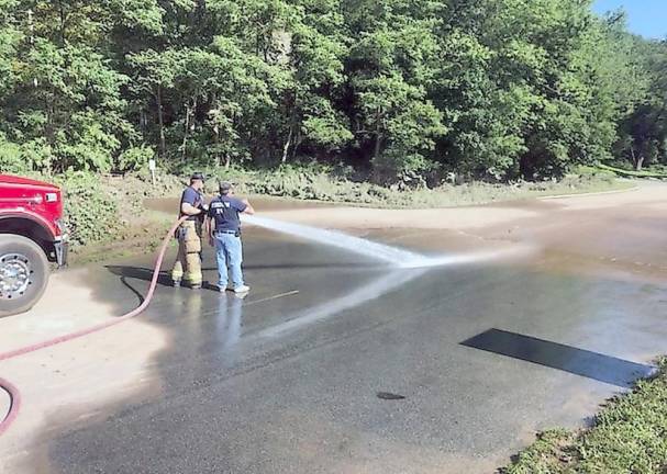 An open and shut case for the park after Ida Firefighters from Bushkill Volunteer Fire Company, Station 24, help clean up after Hurricane Ida (NPS Photo/T. Roessner)
