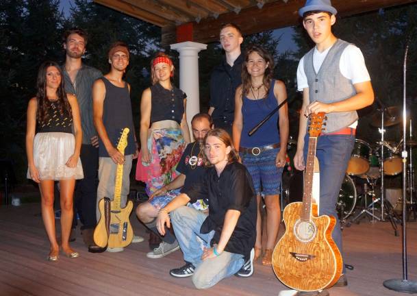 Standing, from left: JaiMe D'Angelo, Christian Hollis, Tyler Goodyear, Emma, Joe Lombardo, Melissa Lucciola, and Micah Freire. Kneeling: Don Rattino and Marcel LaMorte.