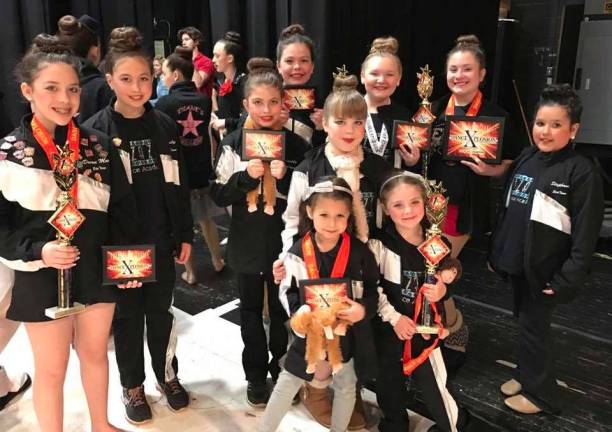 Pizazz students succeed at competitions Pizazz! Elite Team is from DanceXplosion (Devan Meggiolaro, Emily Baker, Cassidy Baker, Talia Greenwood, Samantha Barnable, Katie Molini, Isabella Ferreri, Stephanie Longo, Haydee Orr & Grace Lamattina.