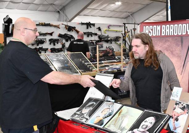 Comic book artist Jason Baroody, right, talks to Matt Sokolowsky of Randolph. (Photo by Maria Kovic)