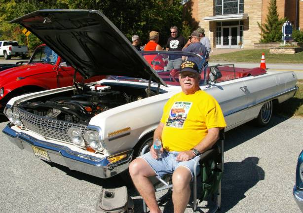 Phil Badu of Highland Lakes showed his 1963 Chevrolet Impala convertible, complete with fuzzy dice hanging from the rear-view mirror and a drive-in movie speaker on the window. Displayed on top of the engine was a model car that matched the real one in every way, but lacked the fuzzy dice.