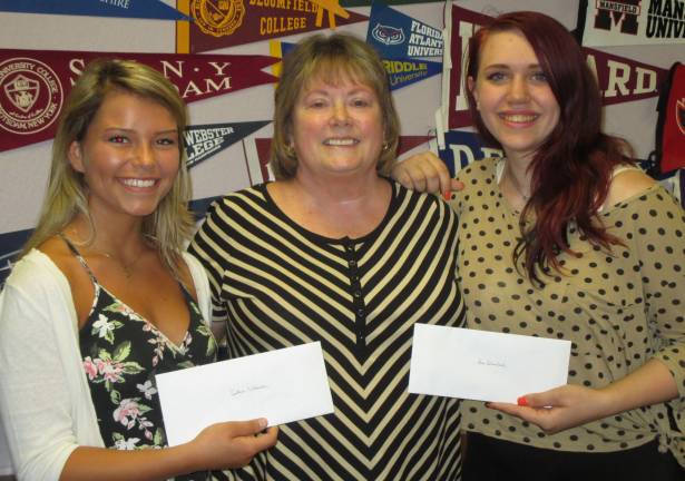 Valerie Seufert, Education Committee Chair for the Vernon Township Woman&#xfe;&#xc4;&#xf4;s Club, congratulates Caitlin McDonald, left, and Ava Blanchard, right, on being selected to attend the four-day Girls Career Institute at Douglass Residential Campus at Rutgers University in New Brunswick. Seufert presented each student with a check for spending money while attending the program to learn about career opportunities for women.