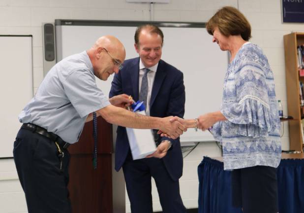 Superintendent Art DiBenedetto congratulates Rolling Hills Gym teacher Kathleen Brodhead on 30 years of service.