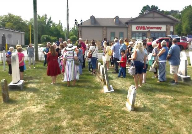 Community members gathered in the church cemetery to hear a bit more about the church’s history.