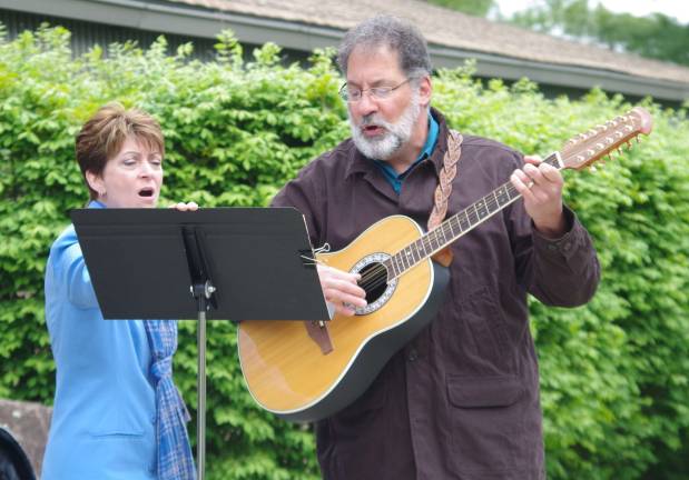 Pastor Nik Fontana of the Faith With Love Fellowship at the McAfee Bible Church played the guitar and sang along with his wife Karyn.