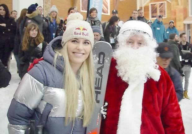 World Champion and Olympic Gold Medalist Lindsey Vonn with Santa at the opening of indoor BigSnow Resort