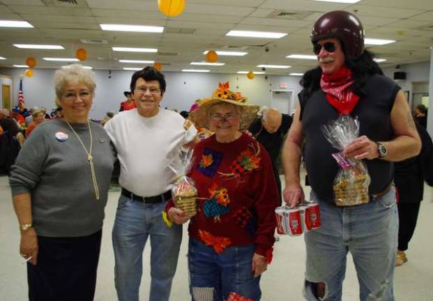 Contest winners were, from left, first-place winners Gloria and Fred Frato of Highland Lakes as characters from the play &quot;Grease.&quot; Marje McCann of Lake Panorama placed second as a scarecrow lady and Highland Lakes resident Phil Badu won third place as an outlaw biker.