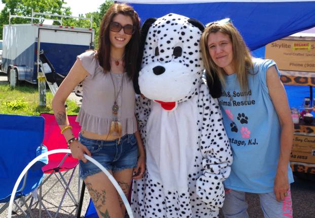 Safe &amp; Sound Animal Rescue co-owners Ashley Adam and her mother Karyn Pirl of Wantage-based Safe &amp; Sound Animal Rescue stand by their meet and greet table with &quot;Dippy the Dalmatian.&quot; This year the part of Dippy was played by 11-year-old Kyleigh Colabella.