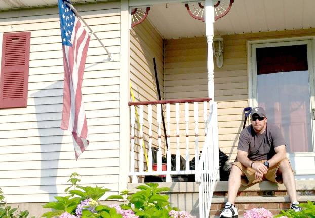Photos by Leigh Tenore Highland Lakes resident, a 7-year veteran of the Marine Corps is shown outside his Highland Lakes home in Vernon Township.