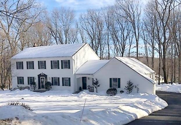 Four-bedroom colonial located in a pool community