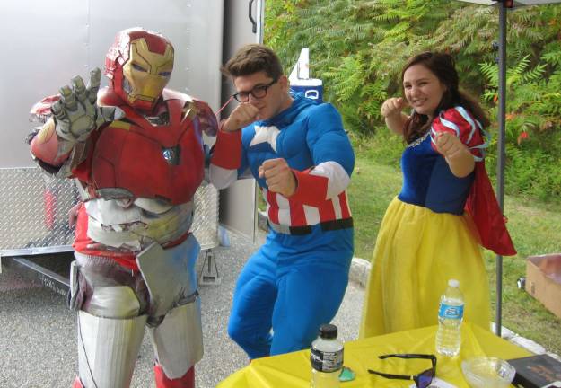 Vernon Township High School drama students, from left, Mike Tlatelpa, Nathan Fitch and Cindy Sparta work the crowd at the 2017 Vernon Street Fair.