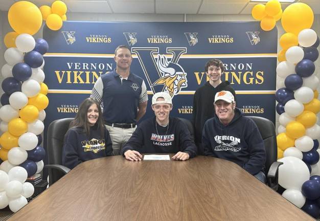 Vernon Township High School senior Ty Holden, center, agrees to play lacrosse at Western Connecticut State University next year. Seated with him are his parents, Lori and Bill. Standing are Adam Coleman, head boys lacrosse coach, and Mason, Ty’s cousin. (Photo provided)