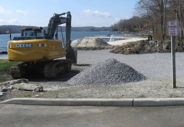 PHOTO BY JANET REDYKE Highland Lakes readies a beach for the upcoming summer season.