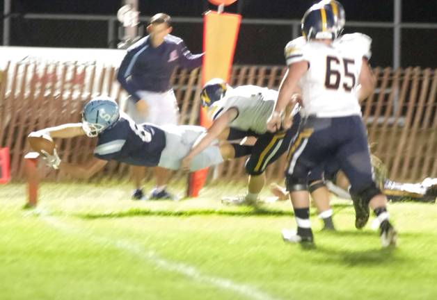 Sparta receiver William Cisko stretches out resulting in the ball crossing the goal line for a touchdown in the first quarter.