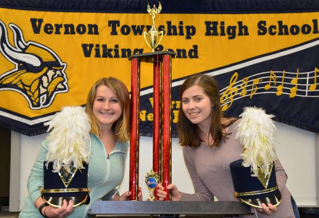 Drum Majors march to a winning beat Michelle Miani (l) and Allie Specht, Drum Majors, take special delight in showing off the Yamaha Trophy, the coveted trophy Vernon Township High School won for the first time this year. They had to beat 14 other Marching Bands to earn the right to bring it home.
