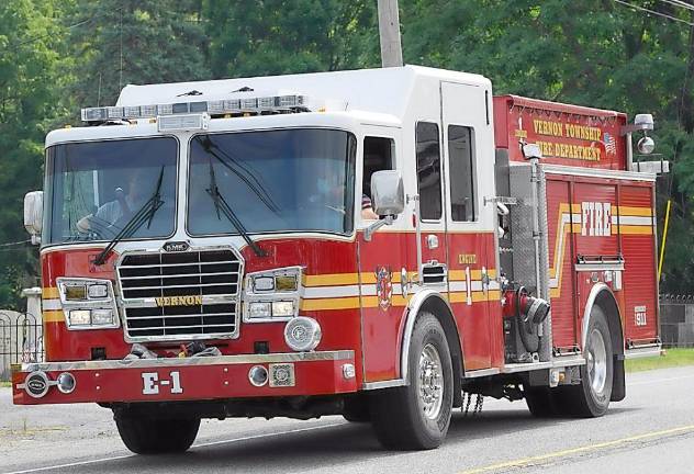 The Vernon Township Fire Department drives by honking support.