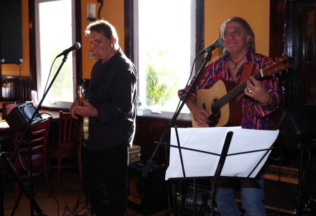 The Shed Band members Randy Pachella and Armand DeBlasio performed a series of Halloween type and traditional songs for the audience.