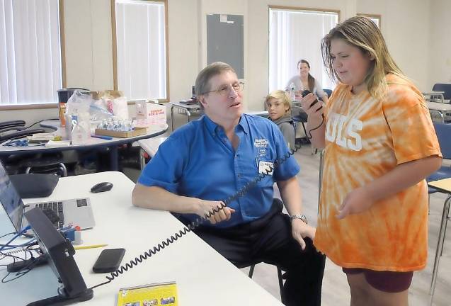 Fred Kemmerer works with a Charter student (Photo provided)