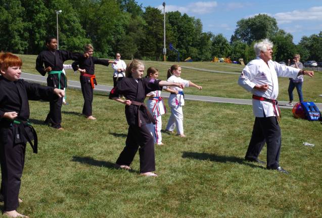 At right, Sensei Tom Shull of the Vernon Valley Karate Academy leads his students in &#xfe;&#xc4;&#xfa;katas,&#xfe;&#xc4;&#xf9; or systems of individual training exercises for karate and other martial arts, behind Walnut Ridge Primary School during the school&#xfe;&#xc4;&#xf4;s Fall Harvest Open House.