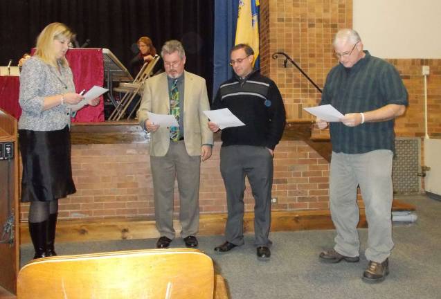 Photo by Vera Olinski Sussex-Wantage School District Administrator christina Riker swears in new members of the of the Board of Education.