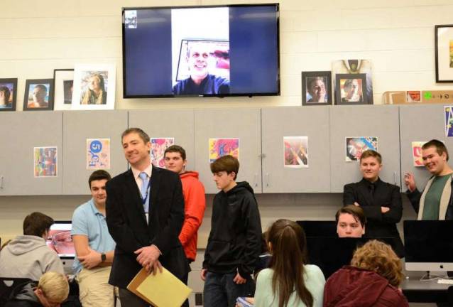 Vernon Township High School students and Visual Arts teacher Doug Miller greet Apple CFO Len Rinaldi into their classroom for a virtual FaceTime session to discuss the importance of education for career success.