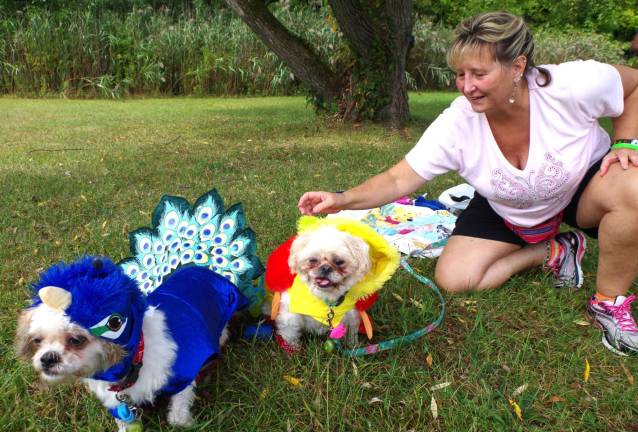 West Milford resident Kimberly Lehman and her dogs Kristy and Kelly prepared for and then competed in the costume contest near the beach in Wawayanda State Park.