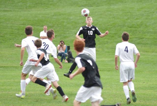 Wallkill Valley's Skylar Hanisch (10) performs a header.