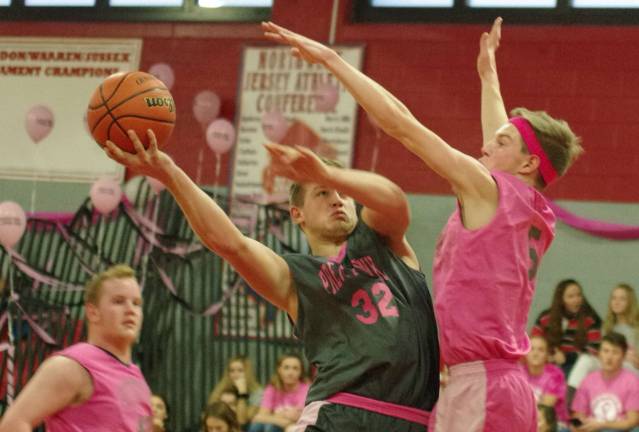 High Point boys win pretty in pink showcase High Point's Travis Tallamy moves the ball towards the basket during a shot while covered by Wallkill Valley's Shawn Falk in the third period.