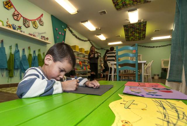 Kids get crafty at Max & Lilly's Gabriel Rizzo, 6, of Sparta hard at work on a project.