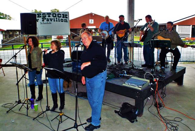 Sussex Christian school holds harvest festival Bluegrass band "Sonrise Mountain Revival" made up of the following members: Gisella Maldonado, Laura Kortright & Sarah DeGennaro on the fiddle, Dick Malmstrom on the banjo, Rich Ferguson on the mandolin, Jeff Holcomb & Mark Kelly on the guitar, Tal Tanis on the bass, Dave DeGennaro on percussion and Megan Carlson, Lee Watts & Greg Gaffney on vocals) captured performing last Saturday at the Sussex Christian School's 38th annual Harvest Festival. Their first song was "I Can See Clearly Now" followed by "Shady Grove".