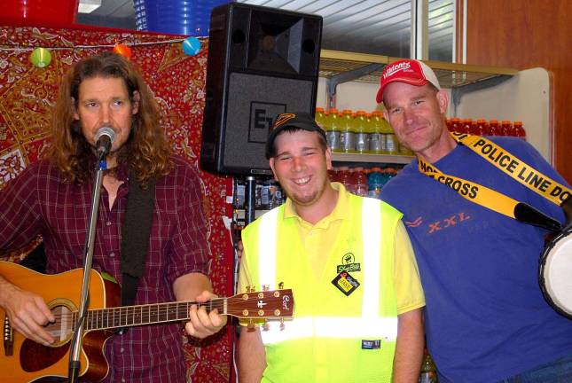 Mingo (Charles Checker) poses with his nephew, Jake, and brother Paul Checkur at the ShopRite of Franklin for the 2015 Partners in Caring campaign.