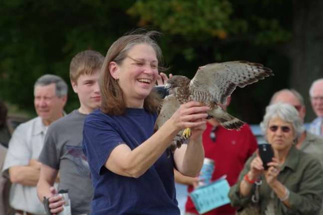 Wallkill visitors treated to two hawk releases Giselle Smisko of the Wantage-based Avian Wildlife Center holds a broad-winged hawks as more than 40 visitors watched at the Wallkill Wildlife Refuge’s satellite office on Owens Station Road.