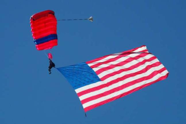 Wantage resident Rich Winstock, who is the owner of Sky Dive Sussex, started the show with a dramatic entrance with a giant American flag. He was the last of several skydivers to arrive at Woodbourne Veterans Memorial Park.