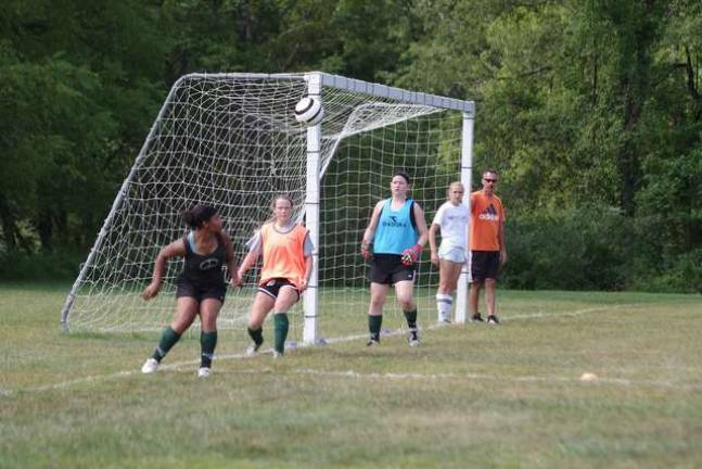 Sussex County Technical School varsity girls head soccer coach Ed Paiva observes practice.