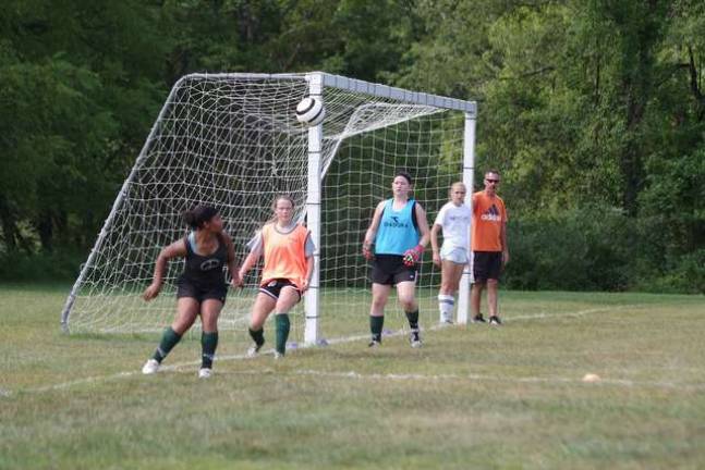 Sussex Tech Mustangs practice for season Sussex County Technical School varsity girls head soccer coach Ed Paiva observes practice.