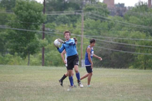 Skylanders goalie Josh Gates with the ball. Gates hails from Australia. He is attending SCCC studying liberal arts.